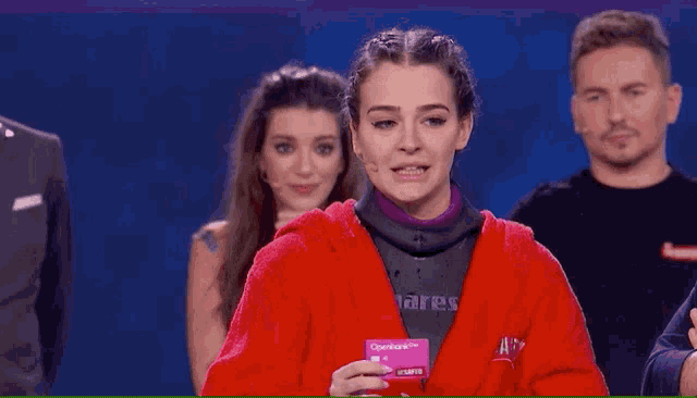 a woman wearing a red hoodie that says mares on it