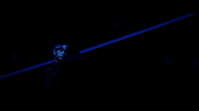 a close up of a person 's eye with a blue light behind them