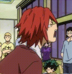 a cartoon character with red hair is standing in a room with a group of people .