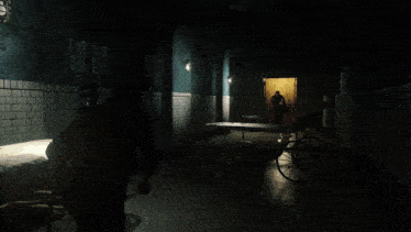 a blurred image of a wheelbarrow in a dark hallway