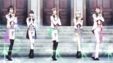 a group of anime characters are standing in a line on a stage .