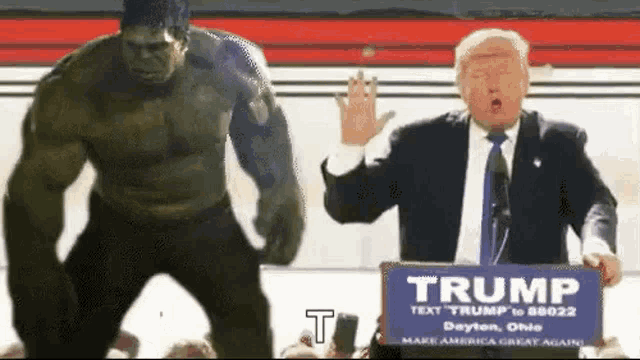 a hulk is standing next to a man holding a trump sign