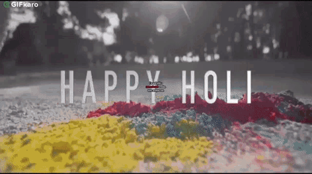 a happy holi greeting card with a pile of colorful powder