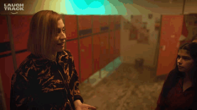 a laugh track ad shows a woman pointing at another woman 's finger