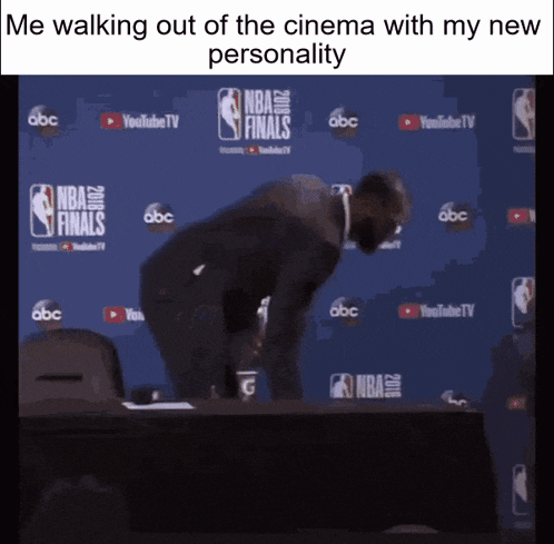 a man is walking out of the cinema with a new personality