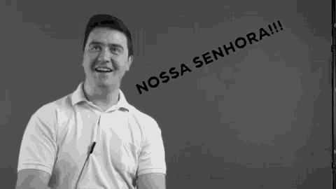 a man stands in front of a blackboard that says nossa senhora