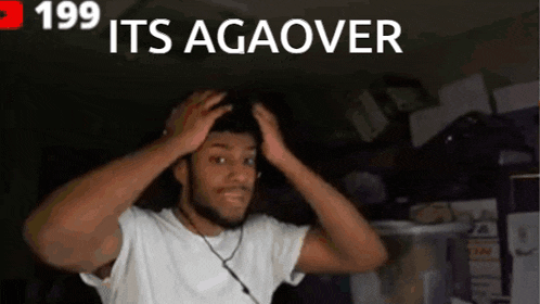 a man in a white shirt is holding his head in front of a sign that says " its agaover "