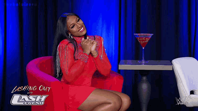 a woman in a red dress is sitting in a red chair with the words lashing out with cash legend written on the bottom