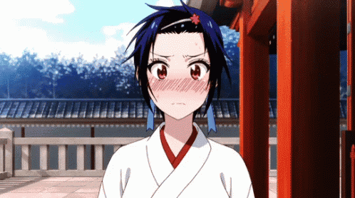 a girl with a flower in her hair is wearing a white and red kimono