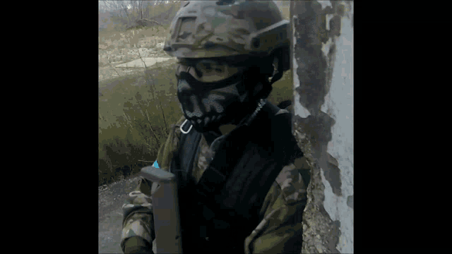 a soldier wearing a mask with a skull on it