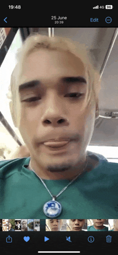 a phone screen shows a photo of a man on june 25