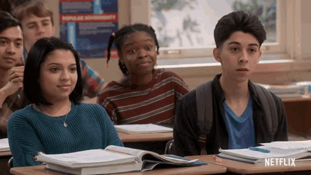 a group of students sit in a classroom with a netflix logo on the bottom right