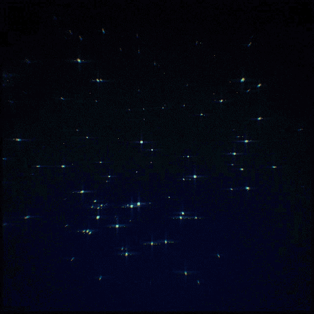 a dark blue background with a lot of sparkles