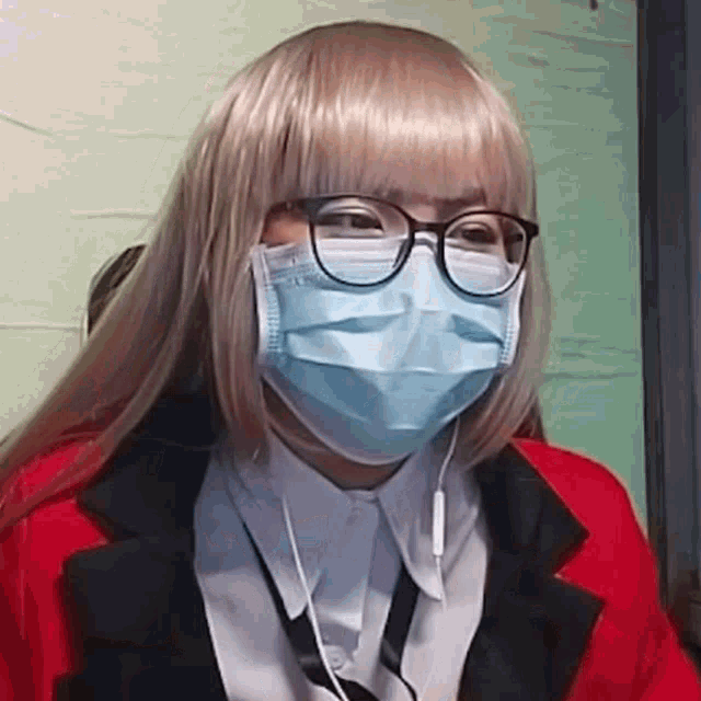 a woman wearing a wig and a mask with glasses .