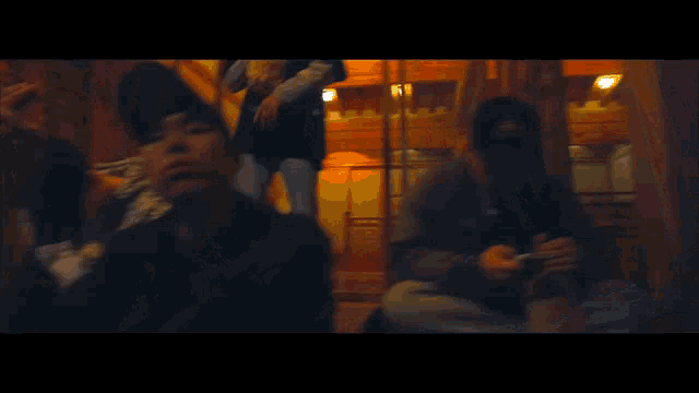 a blurry picture of a man with red eyes and a few lines