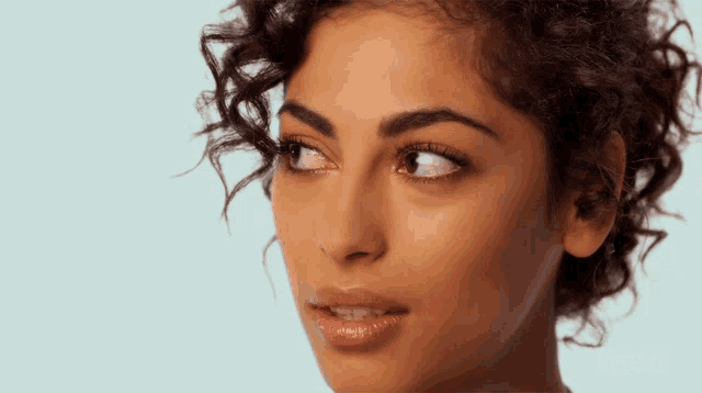 a close up of a woman 's face with the word netflix on the bottom right