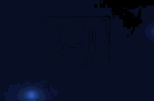 a close up of a blue light coming out of a hole in a dark room .