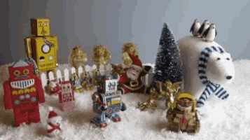 a group of christmas toys including santa claus and a robot with a clock on its head