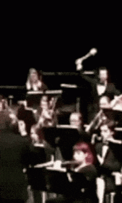 a blurry picture of an orchestra performing on a stage