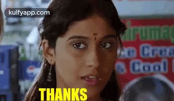a close up of a woman 's face with the words `` thanks '' on it .
