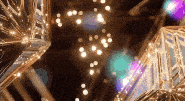 a close up of a christmas tree with a lot of lights