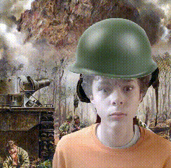 a boy wearing a green helmet and ear muffs