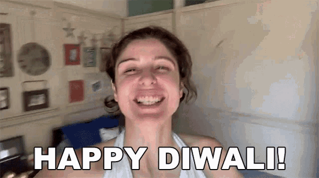 a woman is making a funny face and says happy diwali !