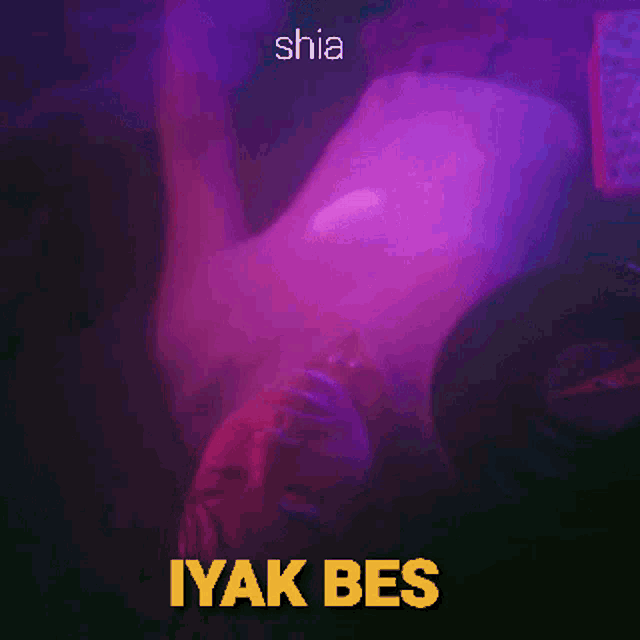 a man is laying on his back with the words shia iyak bes