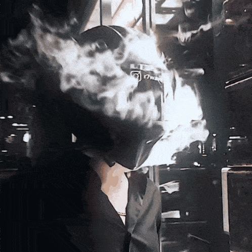 a person with smoke coming out of their mouth wearing a helmet that says ' i7wm ' on it