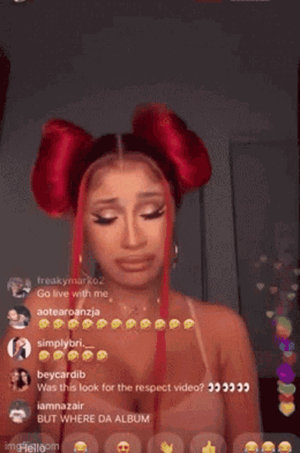 a woman with red hair is crying in front of a live audience