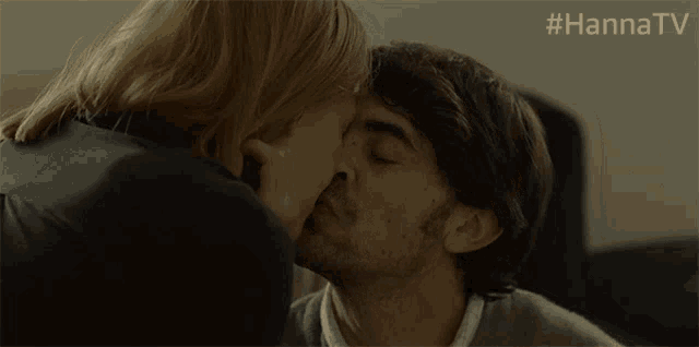 a woman kisses a man on the forehead with the hashtag #hannatv