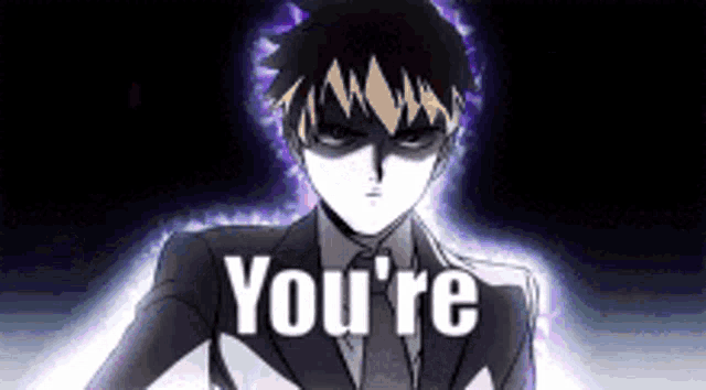 a man in a suit and tie is saying `` you 're '' in a dark room .
