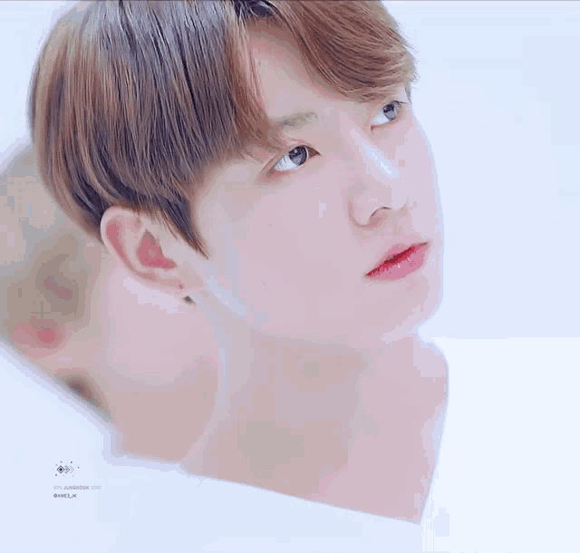 a close up of a person 's face with a watermark that says ' jungkook '