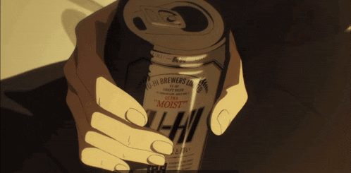 a hand is holding a can of asahi brewers ultra moist beer