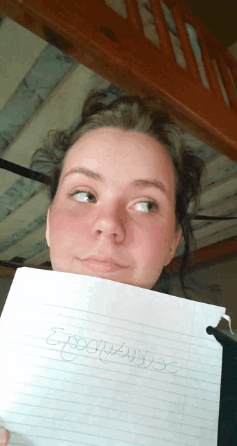 a woman is holding a piece of paper that says epochus