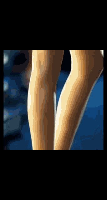 a close up of a woman 's legs in tights