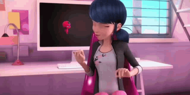 a cartoon character is sitting in a chair in front of a computer .