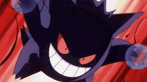 a close up of a pokemon with red eyes and a big smile .
