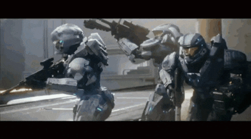 a group of soldiers are standing next to each other and holding guns
