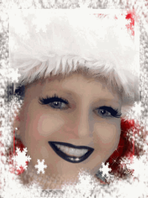 a woman wearing a santa hat with snowflakes around her face