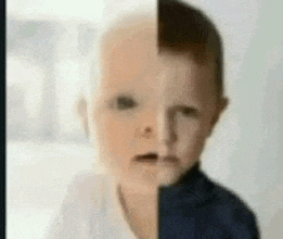 a baby 's face is split in half , one half is bald and the other half is brown .