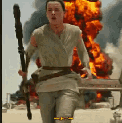 a woman is running in front of a fire with the words we got one on the bottom