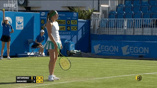 a tennis match is being played on a court with a sign that says aegon