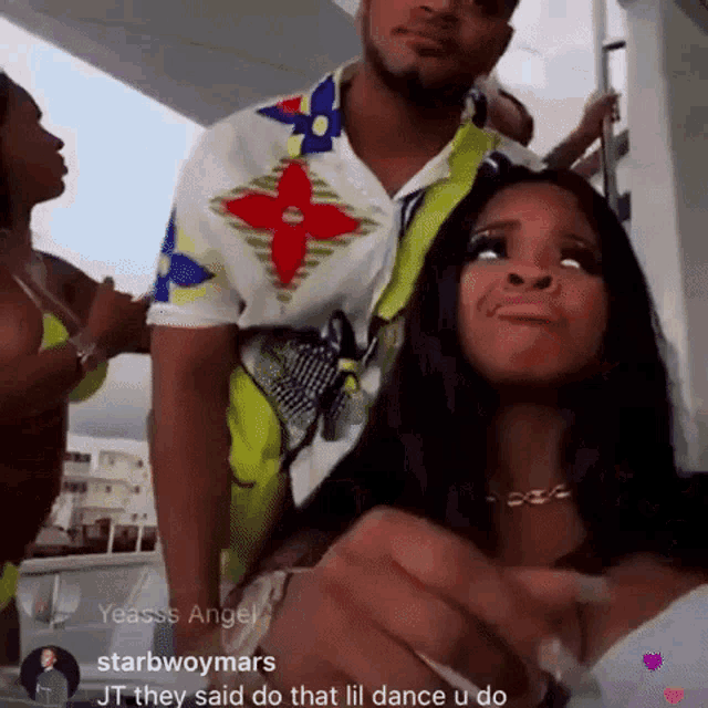 a man and a woman standing next to each other on a boat