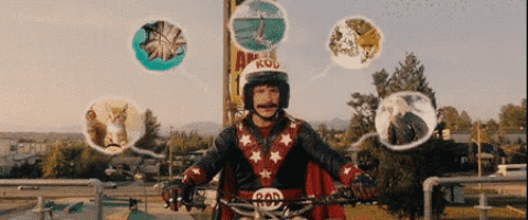 a man riding a bike with a rod helmet on