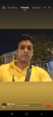 a man in a yellow shirt is standing in front of a building and a message from md ab