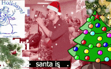 a man in a santa hat singing into a microphone with a christmas tree in the background