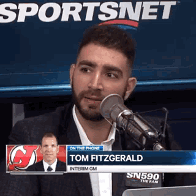 a man talking into a microphone with the name tom fitzgerald on the bottom