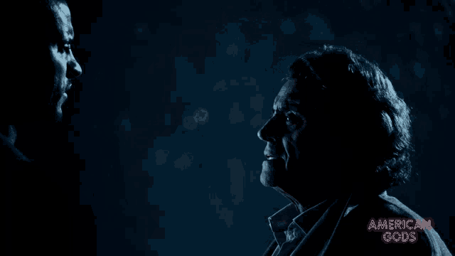 two men are looking at each other with the words american gods visible