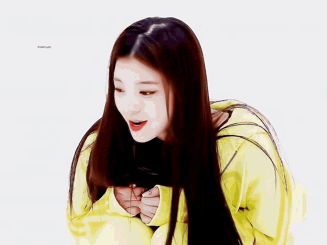 a girl with long hair wearing a yellow jacket with the word freehyun on the bottom right